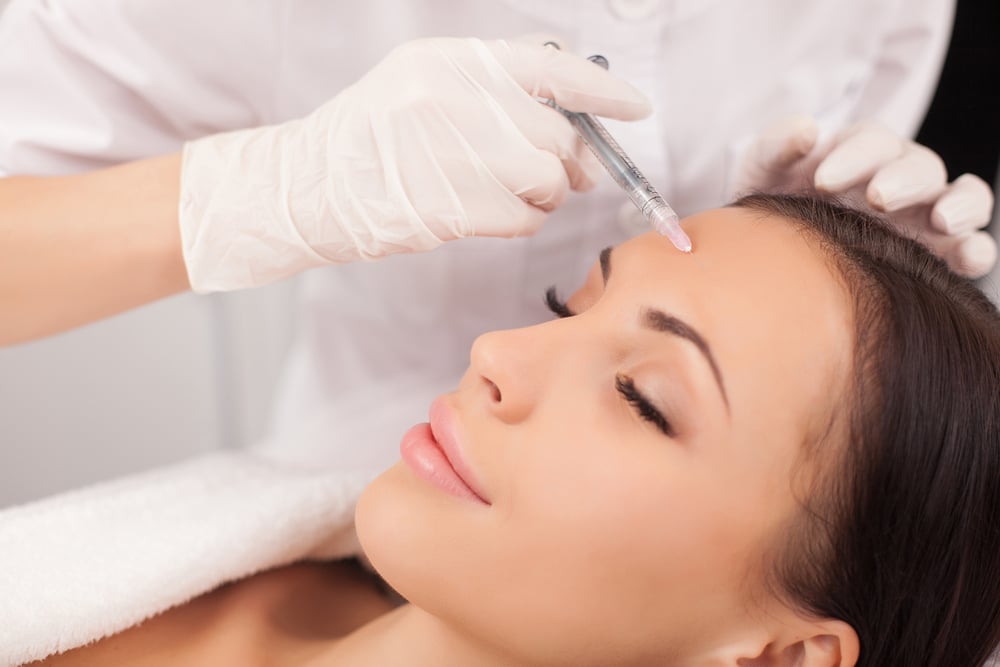 A woman getting BOTOX® Cosmetic in her forehead