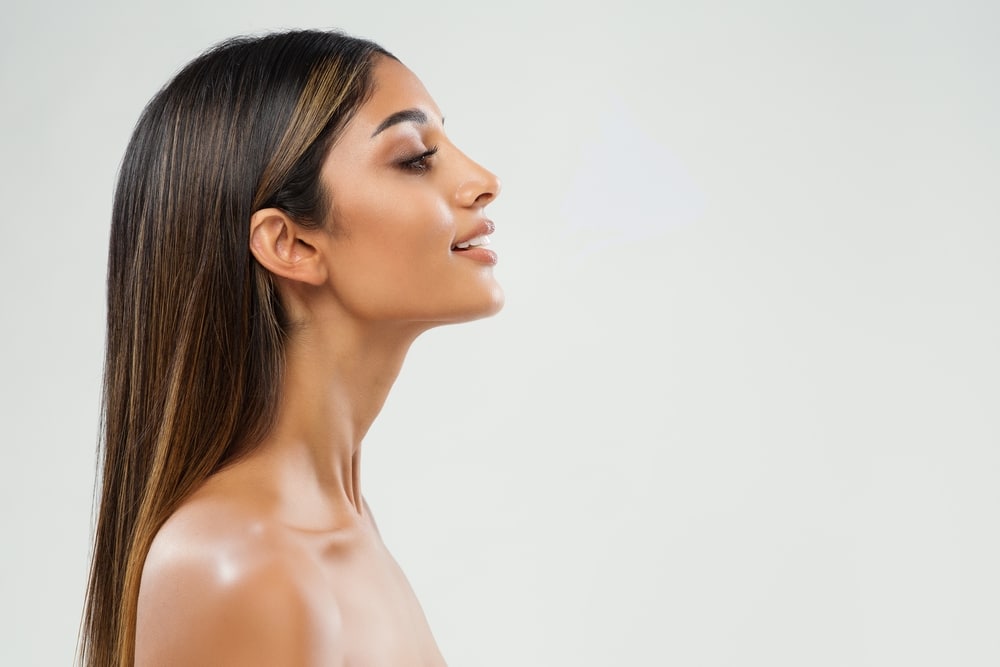 A profile shot of a woman after getting a chin implant in Westlake, OH